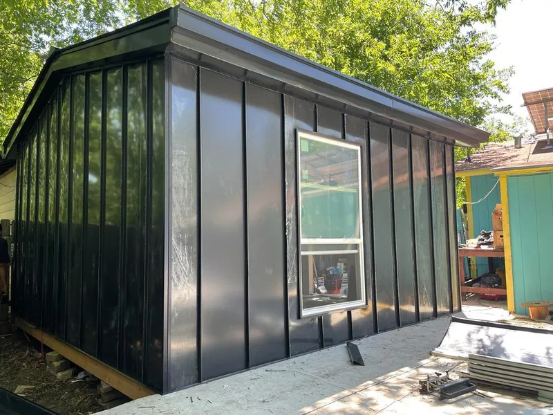 Black standing seam metal wall panels for Roof Inspection in Cottage Grove